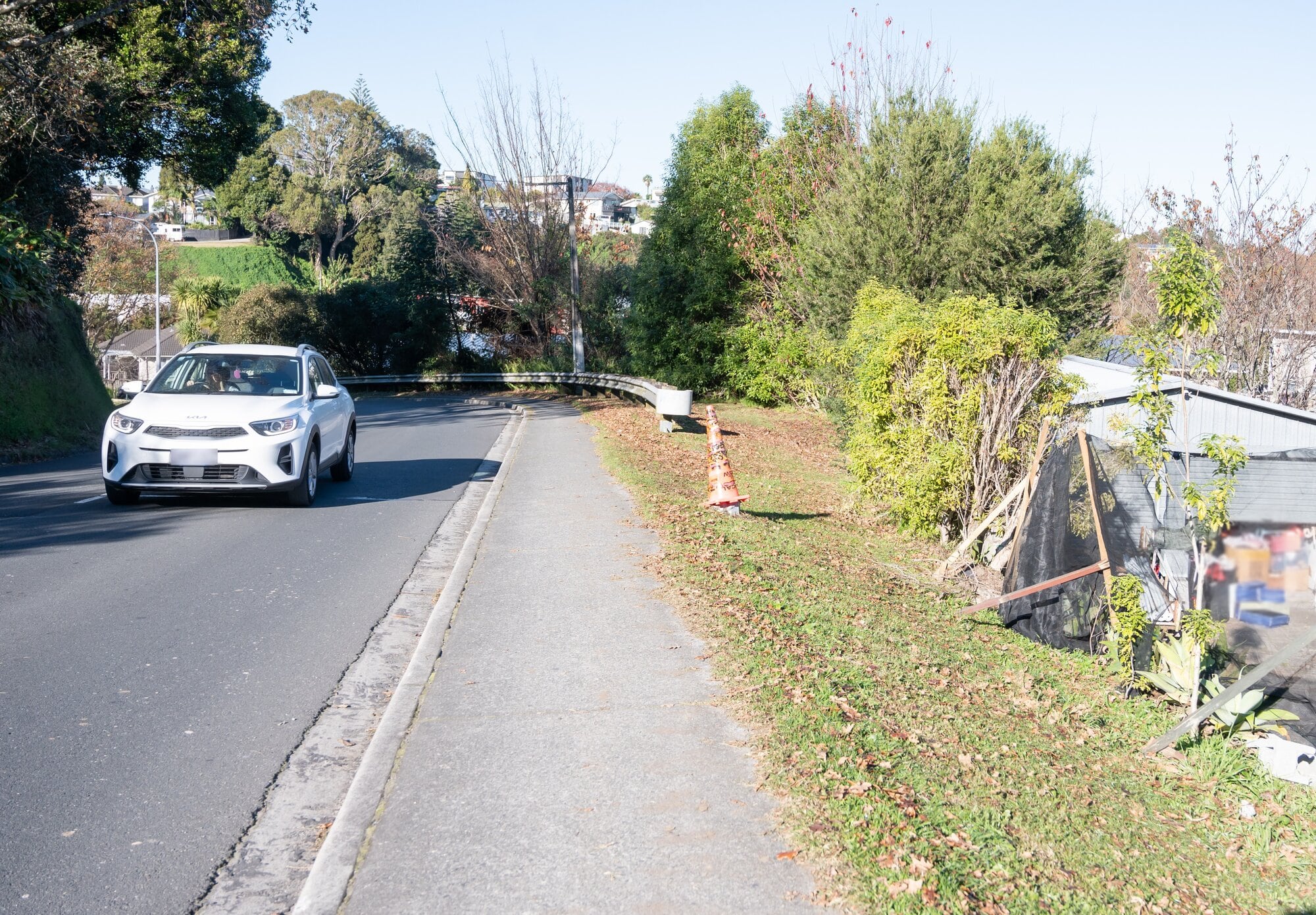Residents of Courtney Rd in Gate Pā have asked the council for safety improvements to the street, including extending the barrier in front of the house on the right. Photo / Brydie Thompson