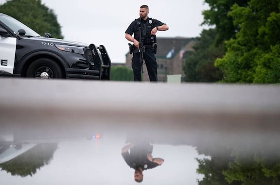 A Brooklyn Park police officer looks on as they guard the entrance to a neighbourhood in Brooklyn Park, Minnesota. Photo / Getty Images