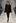 A model wears a design by Adrian Hailwood as part of the Little Black Dress show. Photo / Getty Images