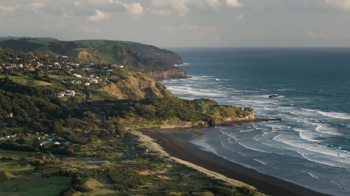 In storm-hit Muriwai, property values have risen by 12%.
