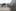 People walk under the <i>Waharoa</i> arch at the Queen Street entrance to Aotea Square. Photo / Paul Harper.