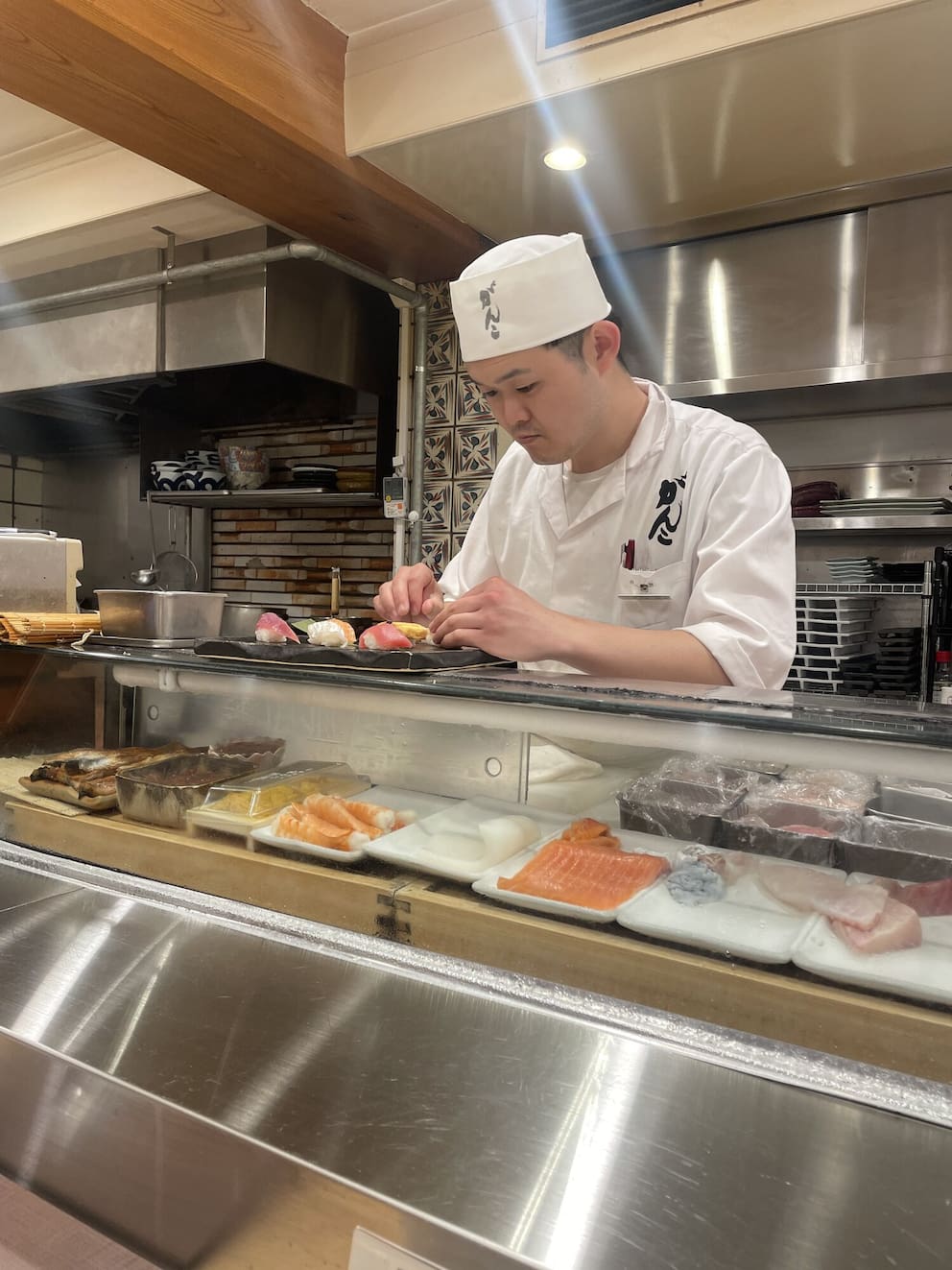 A sushi chef preparing food