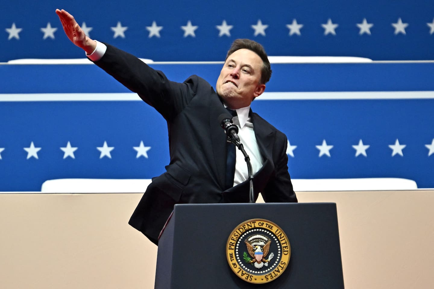 Tesla and SpaceX CEO Elon Musk gestures as he speaks during the inaugural parade inside Capitol One Arena. The Anti-Defamation League said Musk 'made an awkward gesture in a moment of enthusiasm' and it was 'not a Nazi salute'. Photo / Angela Weiss, AFP