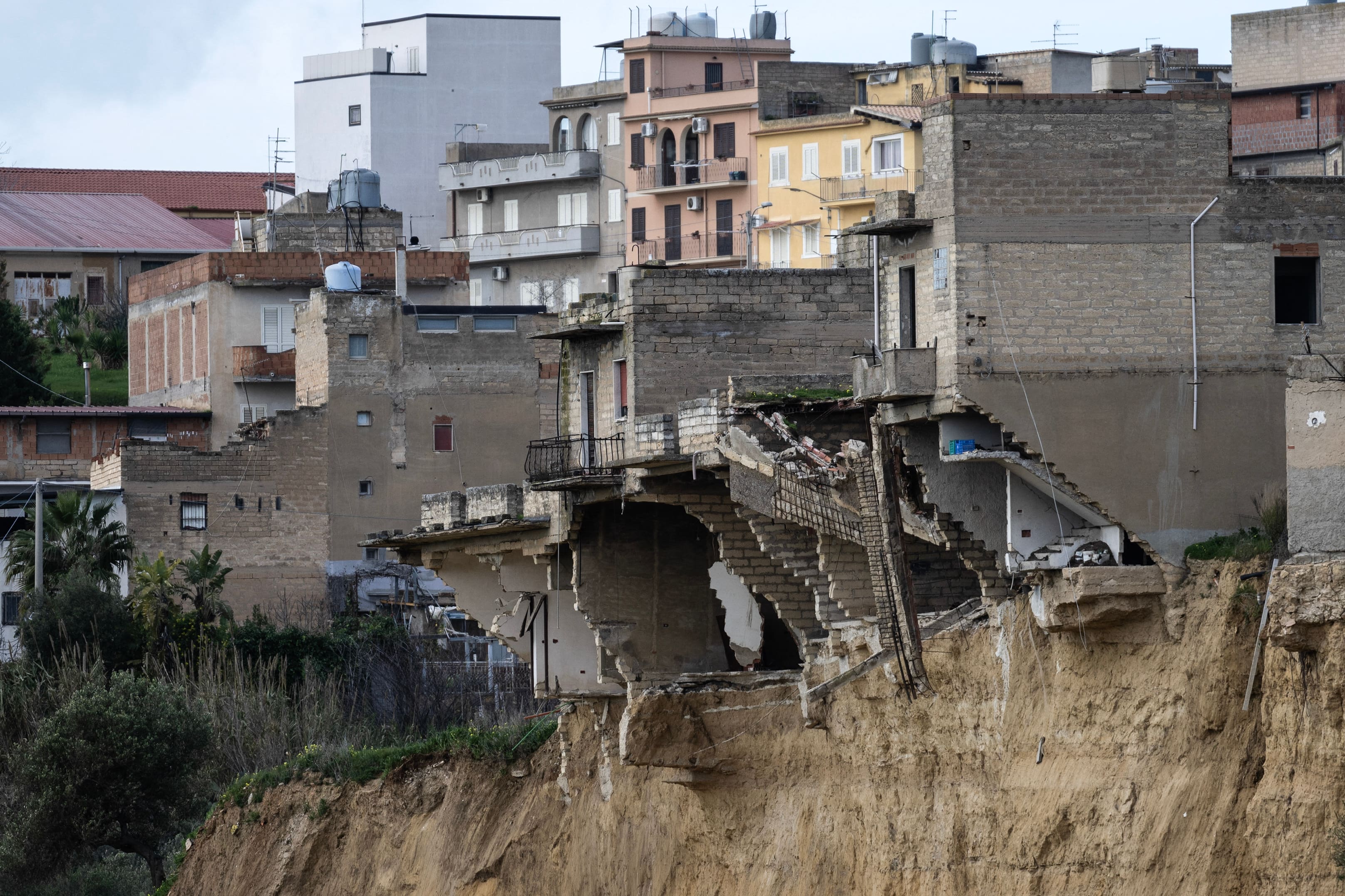 Hundreds of people evacuated after a landslide in Sicily that experts warn could worsen with rain