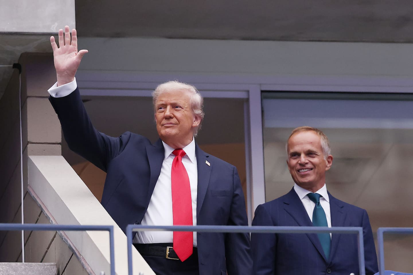 US President Donald Trump and Rolex CEO Jean-Frederic Dufour arrive in the Rolex suite prior to the match between Jannik Sinner of Italy and Carlos Alcaraz of Spain. Photo / Getty Images