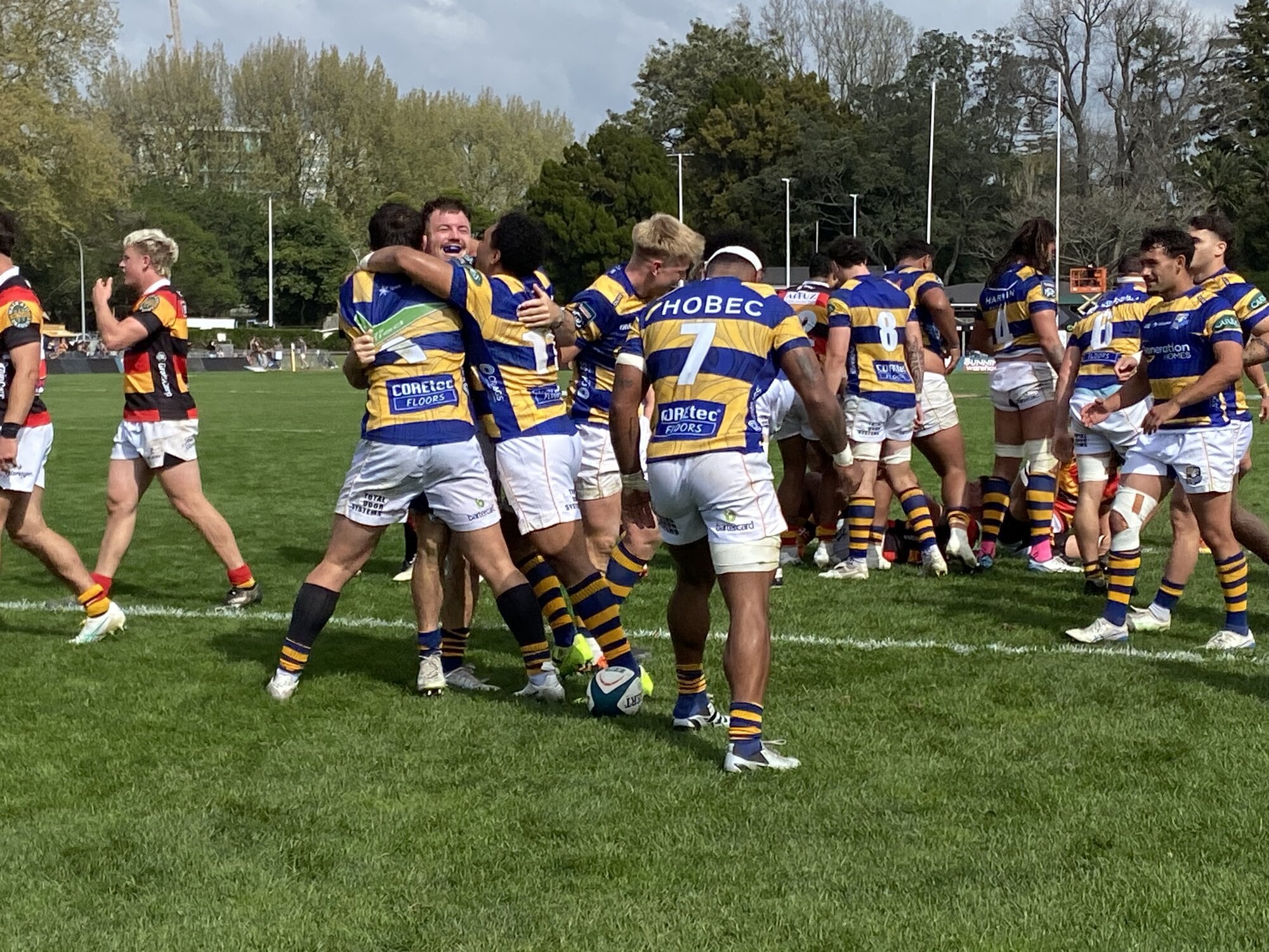 Jubilant Bay of Plenty Steamers players after captain Kurt Eklund scores a try. Photo / Rosalie Liddle Crawford