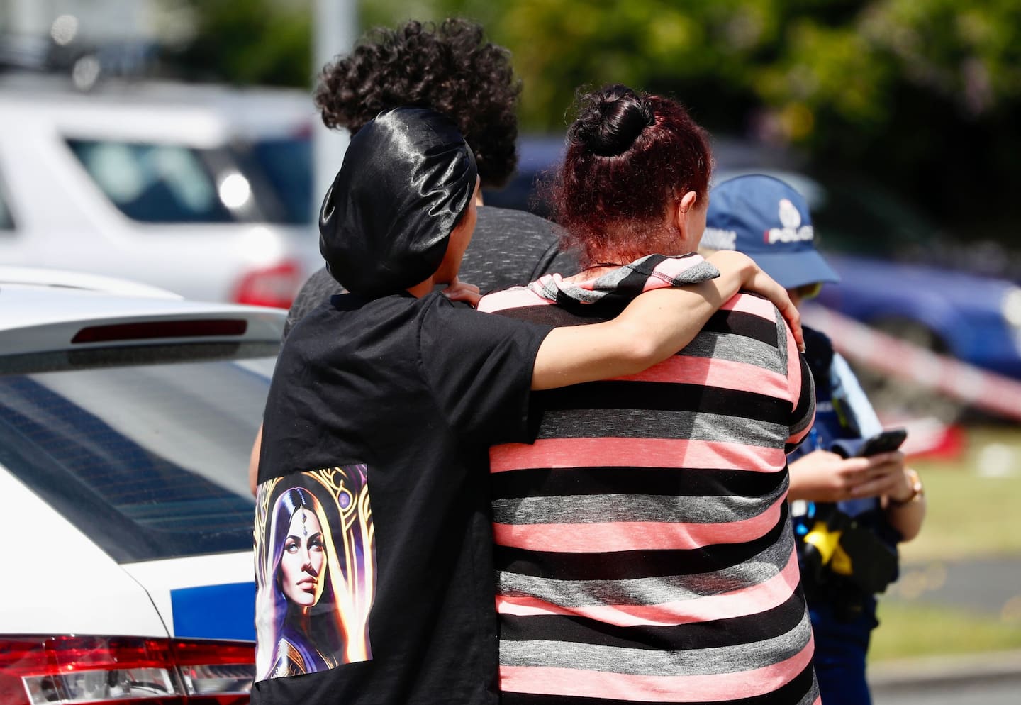 Bystanders talk to Police on Douglas Crescent, Hamilton, where a violent attack resulted in the death of a child and injuries to its mother
New Zealand Herald photograph by Dean Purcell 01 January 2025