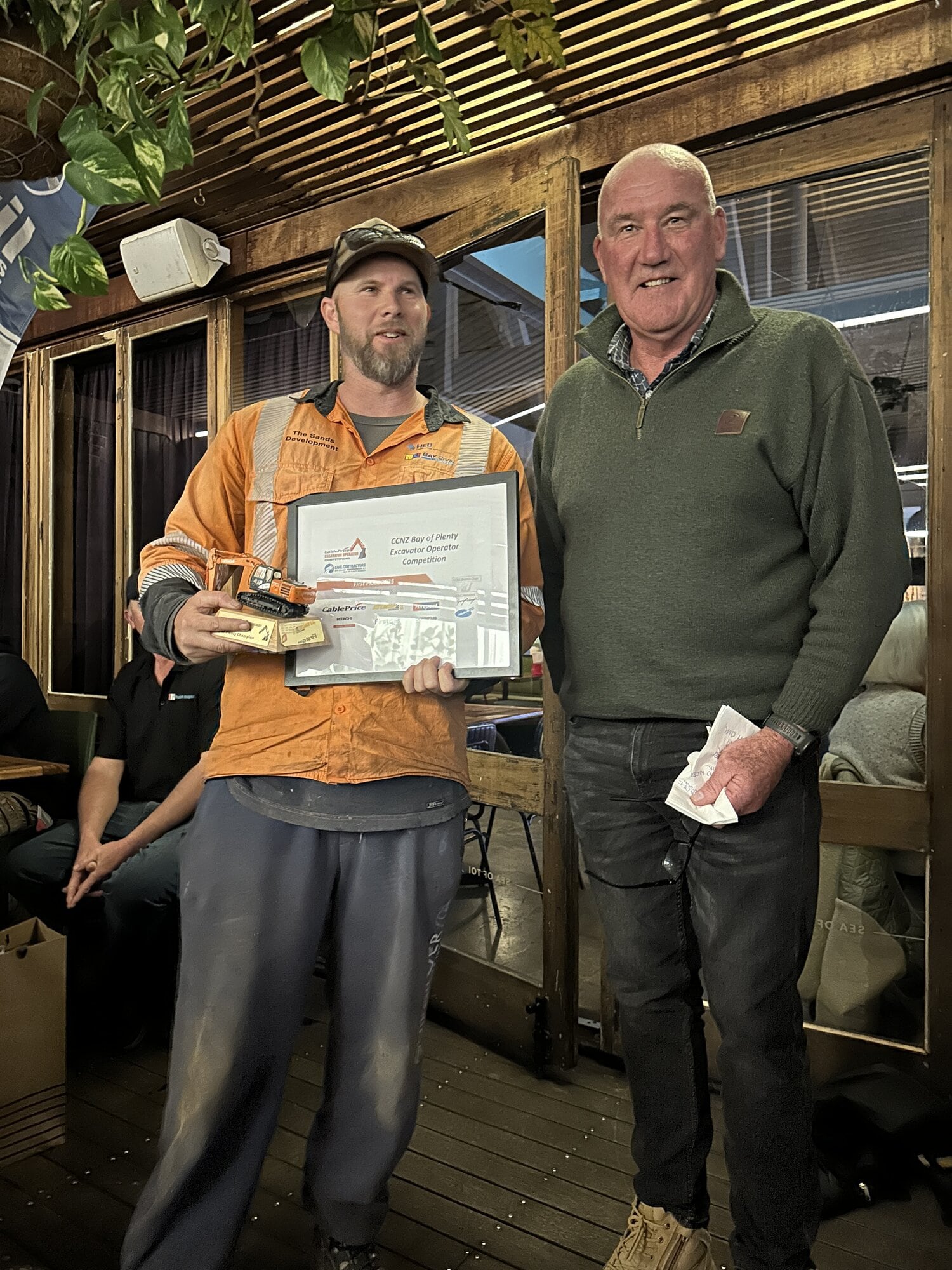 Andy Morris receiving his award from CCNZ Bay of Plenty branch chairman Gerry McLaughlan at the prize-giving on June 26.