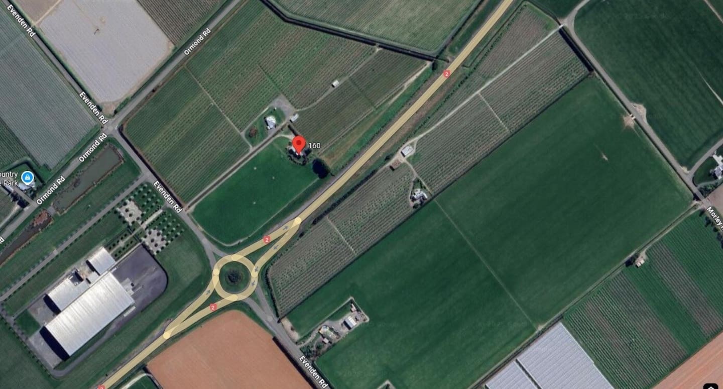A service station on the corner of Evenden Road and State Highway 2 is surrounded by horticulture. Photo / Google Maps