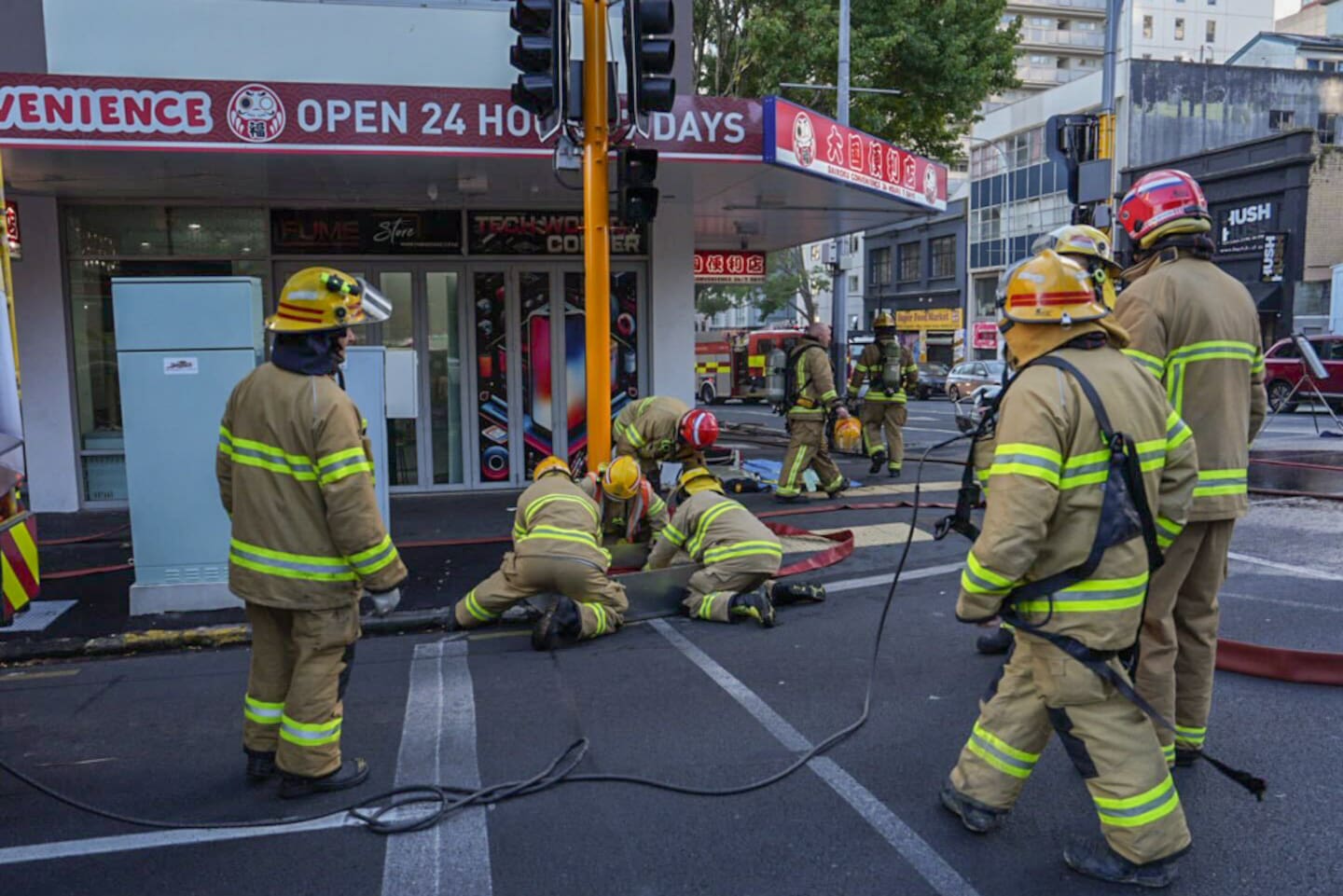 The "well-involved" fire broke out in a shop on the corner of Hobson St and Victoria St West this morning. Photo / Anna Heath