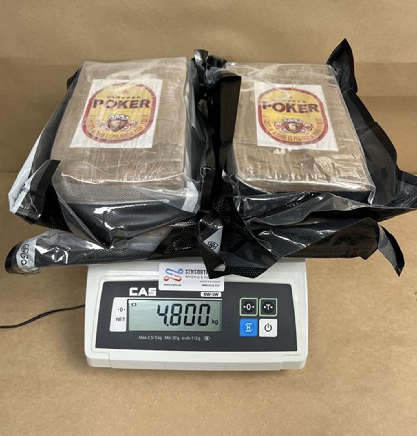 Officers found 85 bricks of a substance wrapped in black film and clear plastic wrapping. Tests returned a positive result for cocaine. Photo / Customs