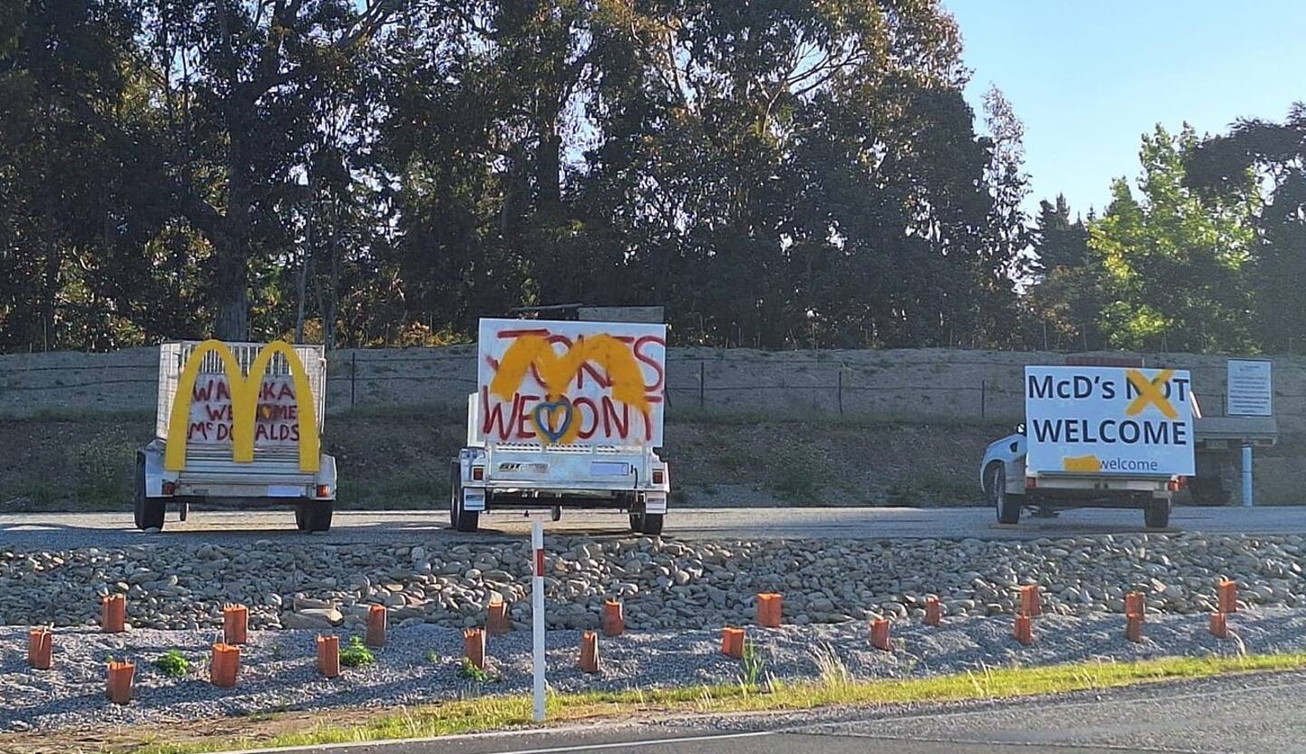 Local beef; signs of protest and support for McDonald's application to build a restaurant in Wānaka.