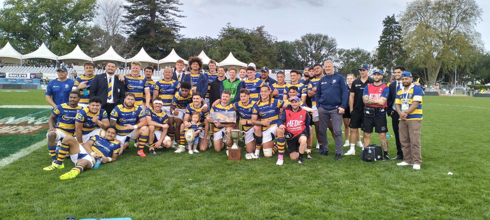 The Bay of Plenty Steamers with the Chief’s Cup and the Nathan Strongman Memorial Trophy. Photo / BoP Rugby Union