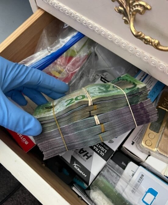  Around $36,000 in cash was located as search warrants were carried out ,police said. Photo / NZ Police