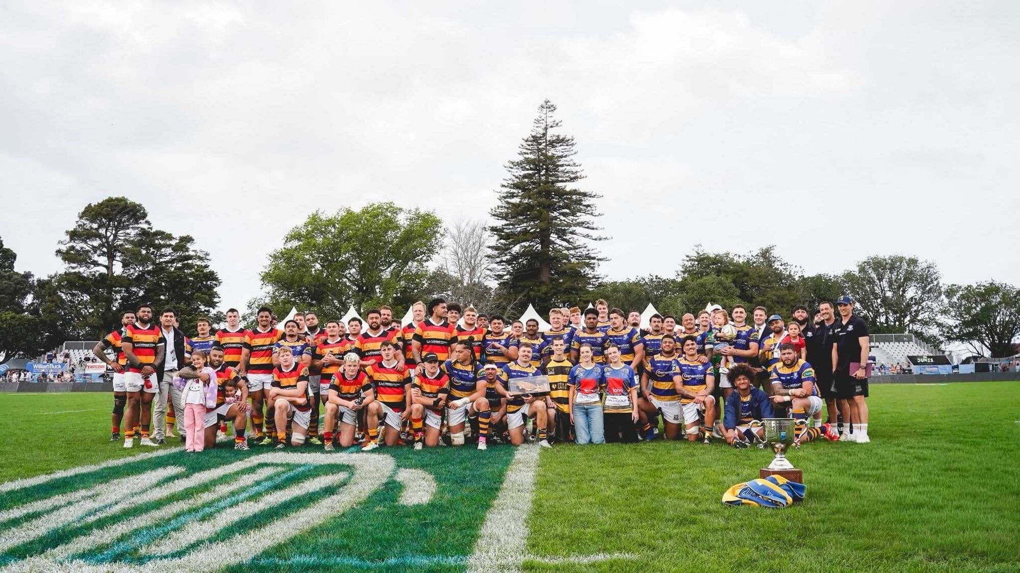 Waikato Mooloos with the Bay of Plenty Steamers and captain Kurt Eklund holding the Nathan Strongman Memorial Trophy. Photo / BoP Rugby Union