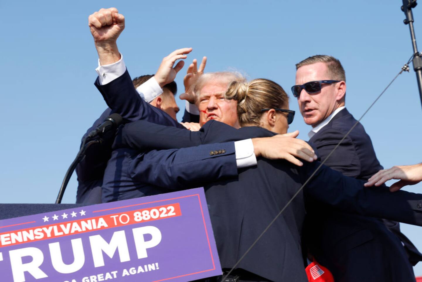 Donald Trump is rushed off stage after the shooting during a rally on in Butler, Pennsylvania. Photo / Getty Images
