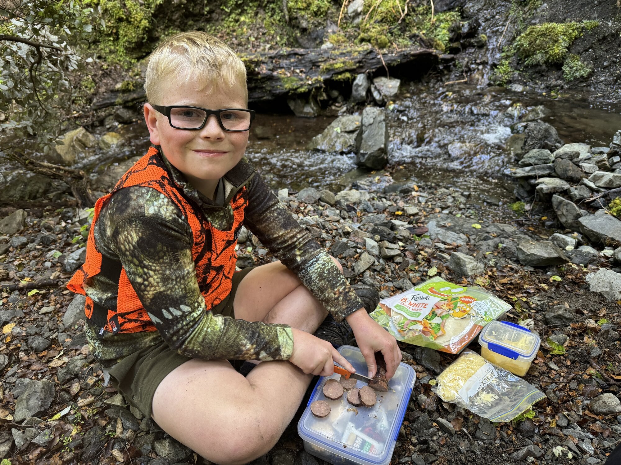  James Fairbairn preparing lunch while out on a hunt. Photo / Jamie Fairbairn