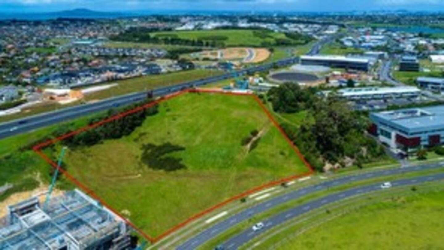 The 1.5ha plot of land at 80 Don McKinnon Drive borders the Northern Motorway and is near the North Shore District Court. Photo / Supplied