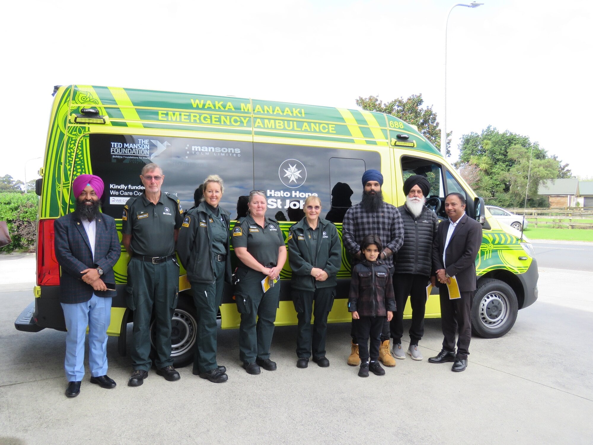  St John staff and We Care Community Trust representatives stand in front of Katikati’s new Gen 4 ambulance after its dedication. Photo / Merle Cave