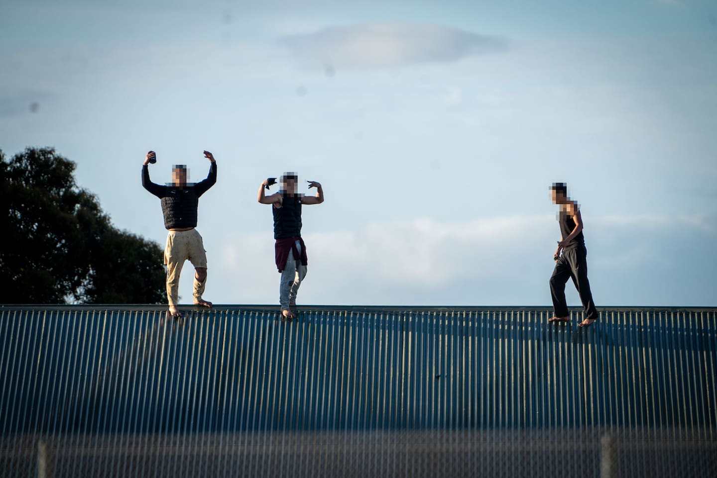 Police, along with youth justice facility staff, remain in negotiations with several youths after they gained access to the roof of its Wiri facility last night. Photo / Carson Bluck