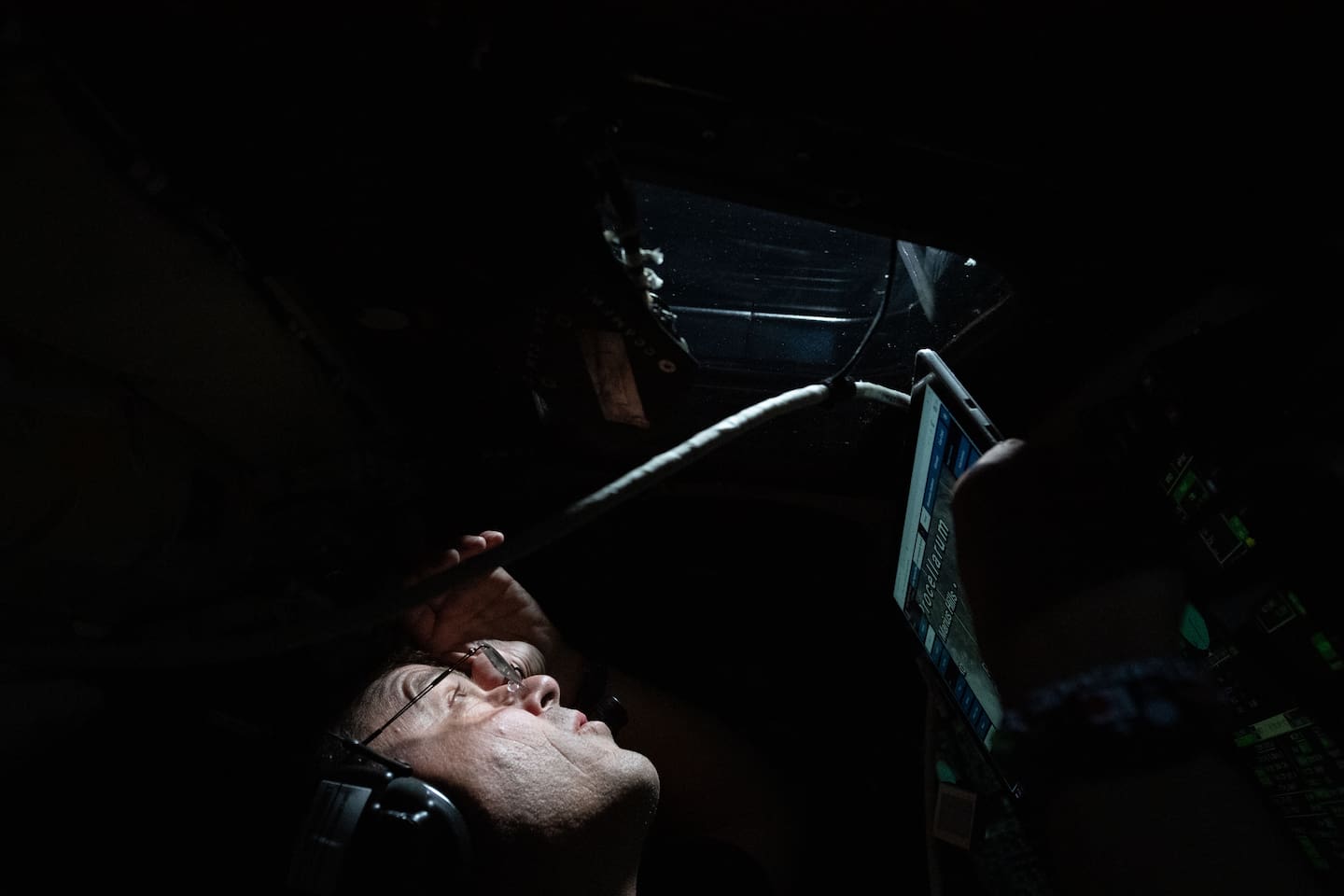 Commander Reid Wiseman peers out the window of the Orion spacecraft as his first lunar observation period of the day begins on April 6. Photo / Nasa