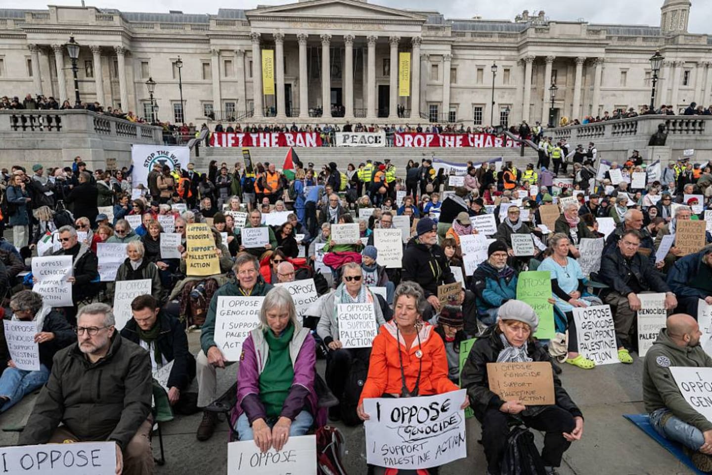 Activists defy the Palestine Action ban by holding illegal signs in Trafalgar Square in London. Photo / Getty Images