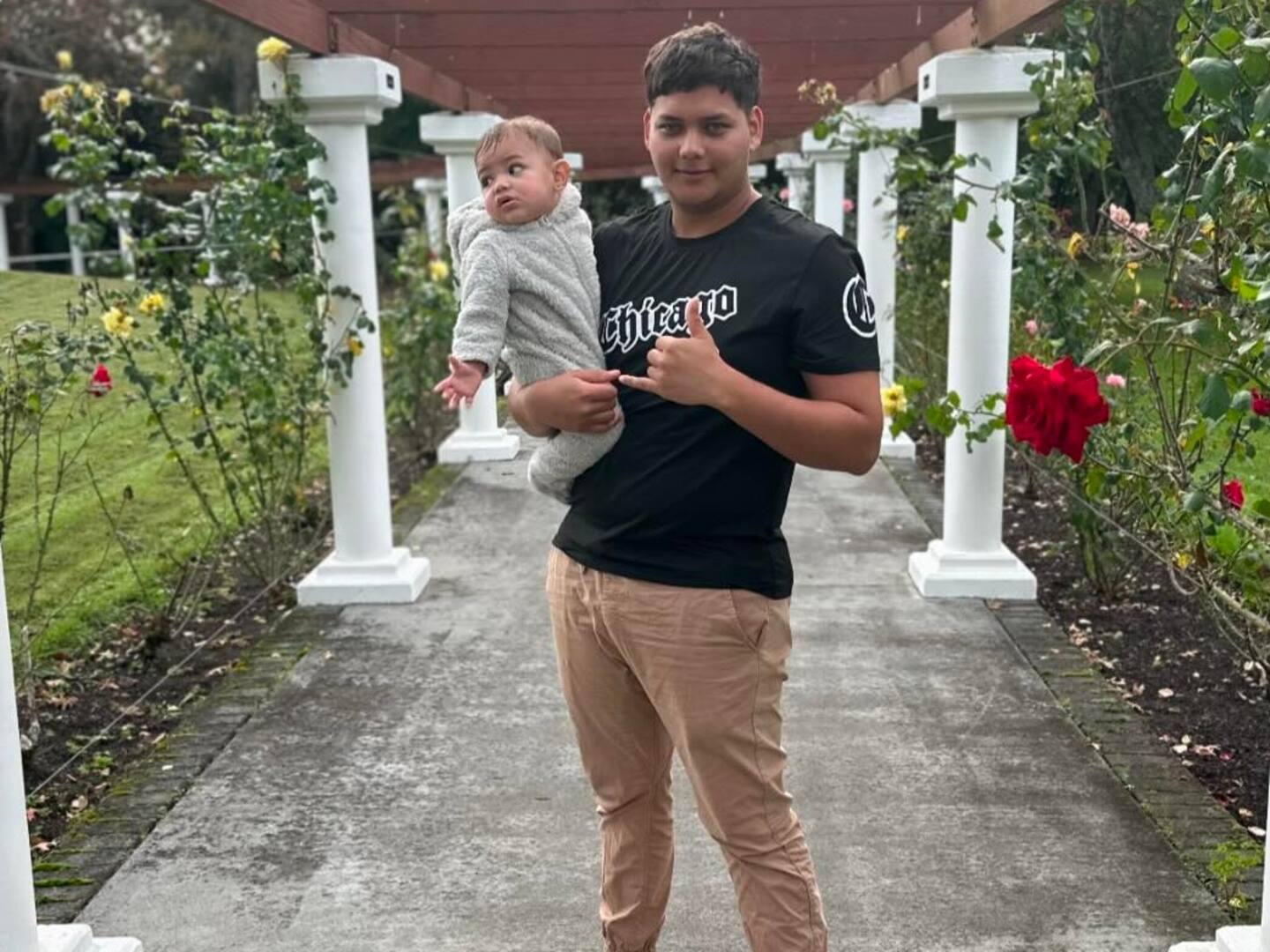 Mukzameel Ali holding baby Mustafa Maheir Mukzameel Ali.