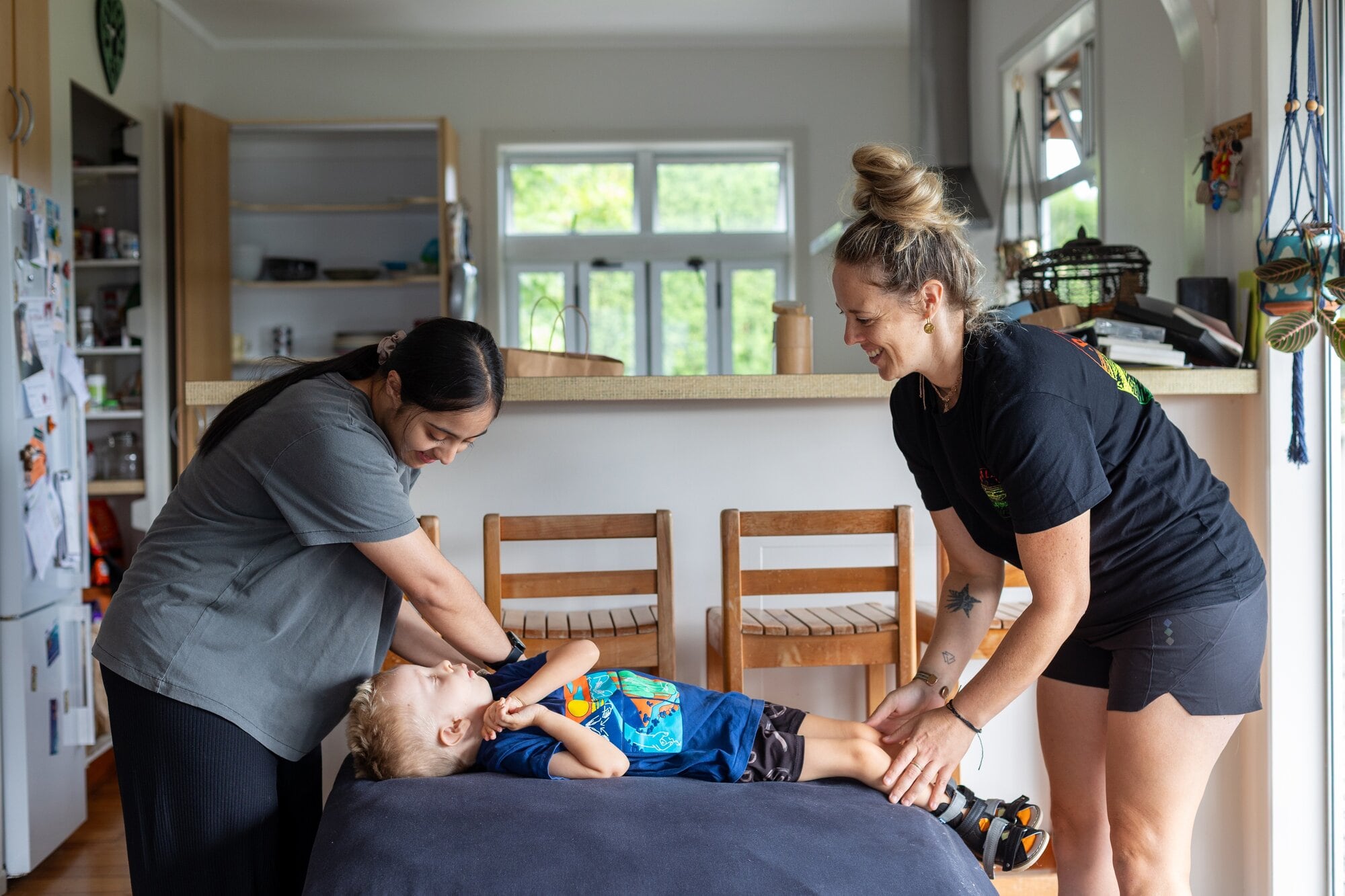  Ruhani Chauhan helping 5-year-old Blayde Arnold and his mother Marissa Mason with Blayde&rsquo;s Sunday physiotherapy sessions. Photo / Natalie Murdoch