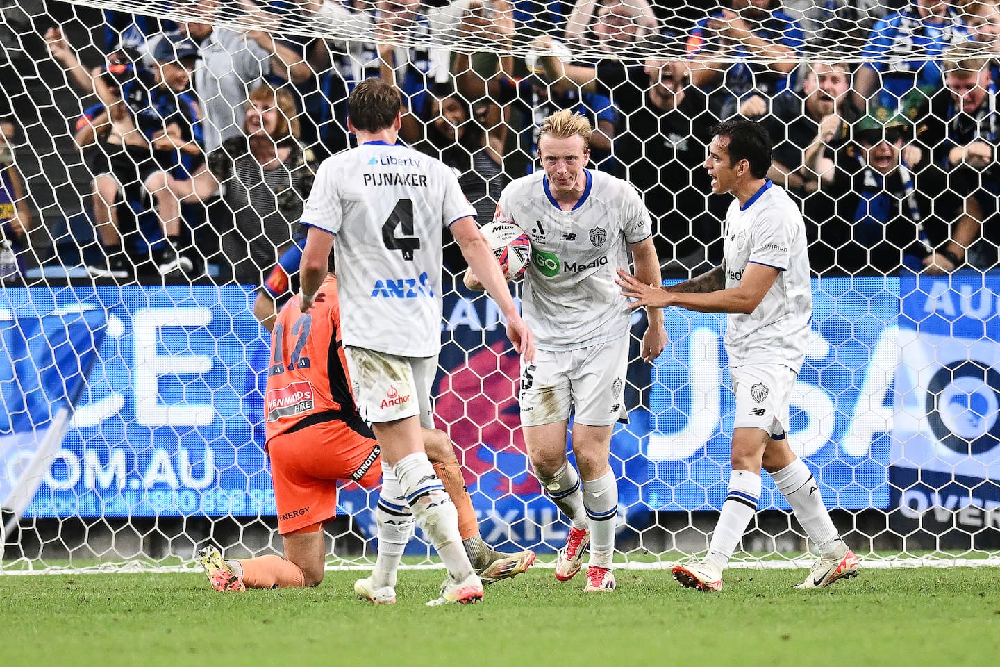 Francis De Vries celebrates with teammates after scoring a goal against Sydney FC. Photo / AAP