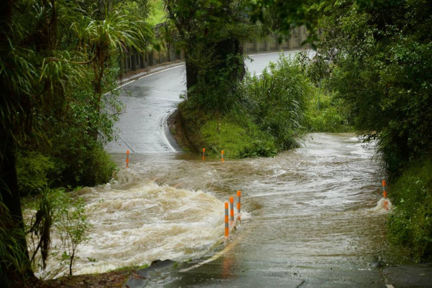 The swollen ford crossing on Falls Rd, Warkworth. A man and his vehicle are missing after being washed away at the crossing on Wednesday morning. Photo / Jason Dorday