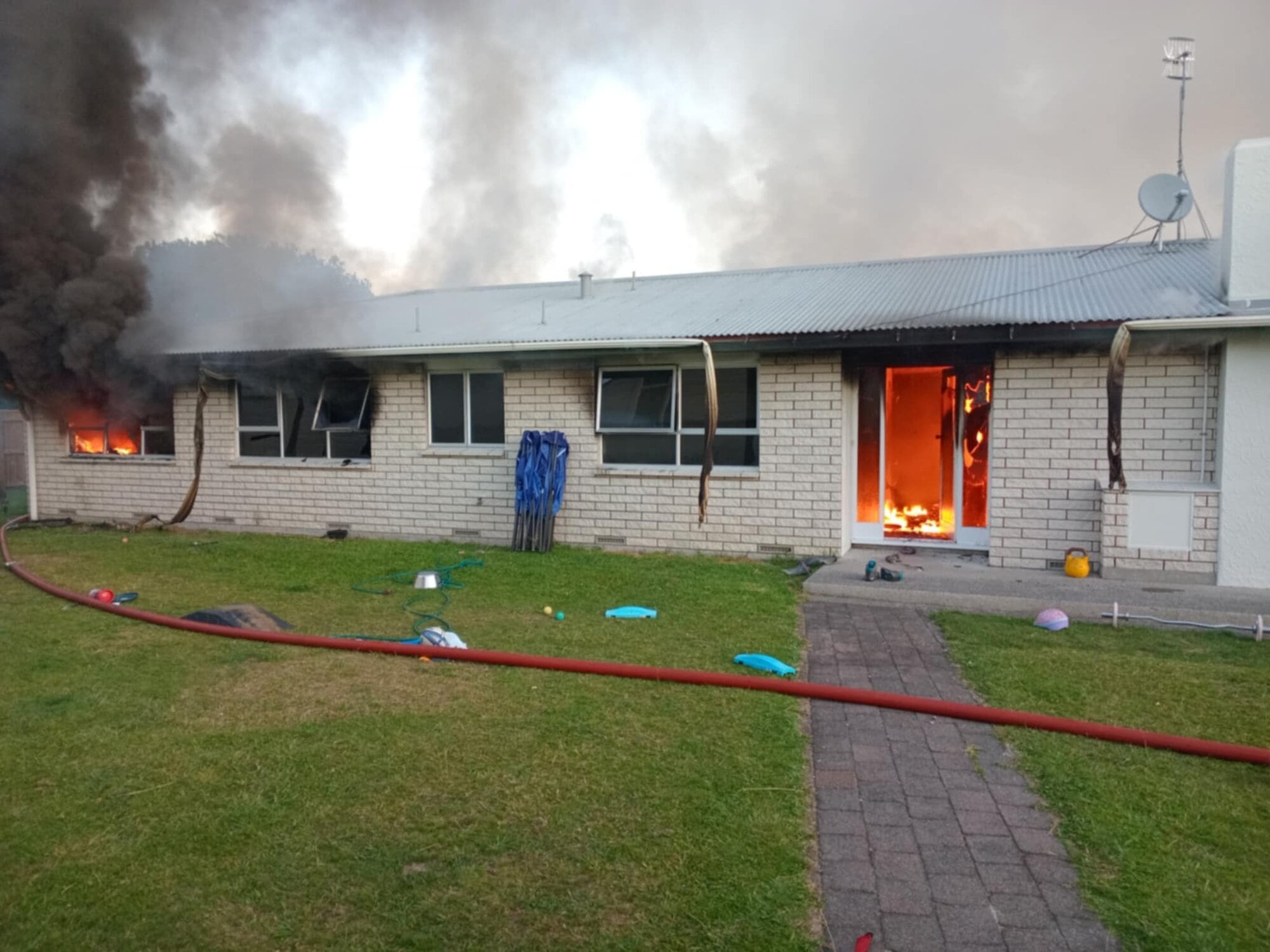  Four crews remained at the house to dampen down hot spots until around 9.40pm. Photo / Supplied