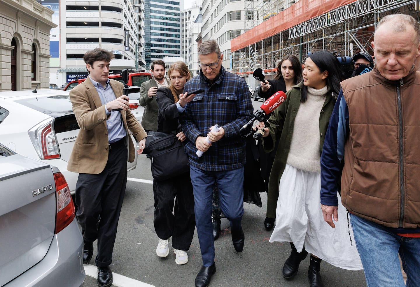 Jevon McSkimming is pursued by media as he leaves the Wellington District Court, Wellington, 04 August, 2025. NZ Herald photograph by Mark Mitchell
