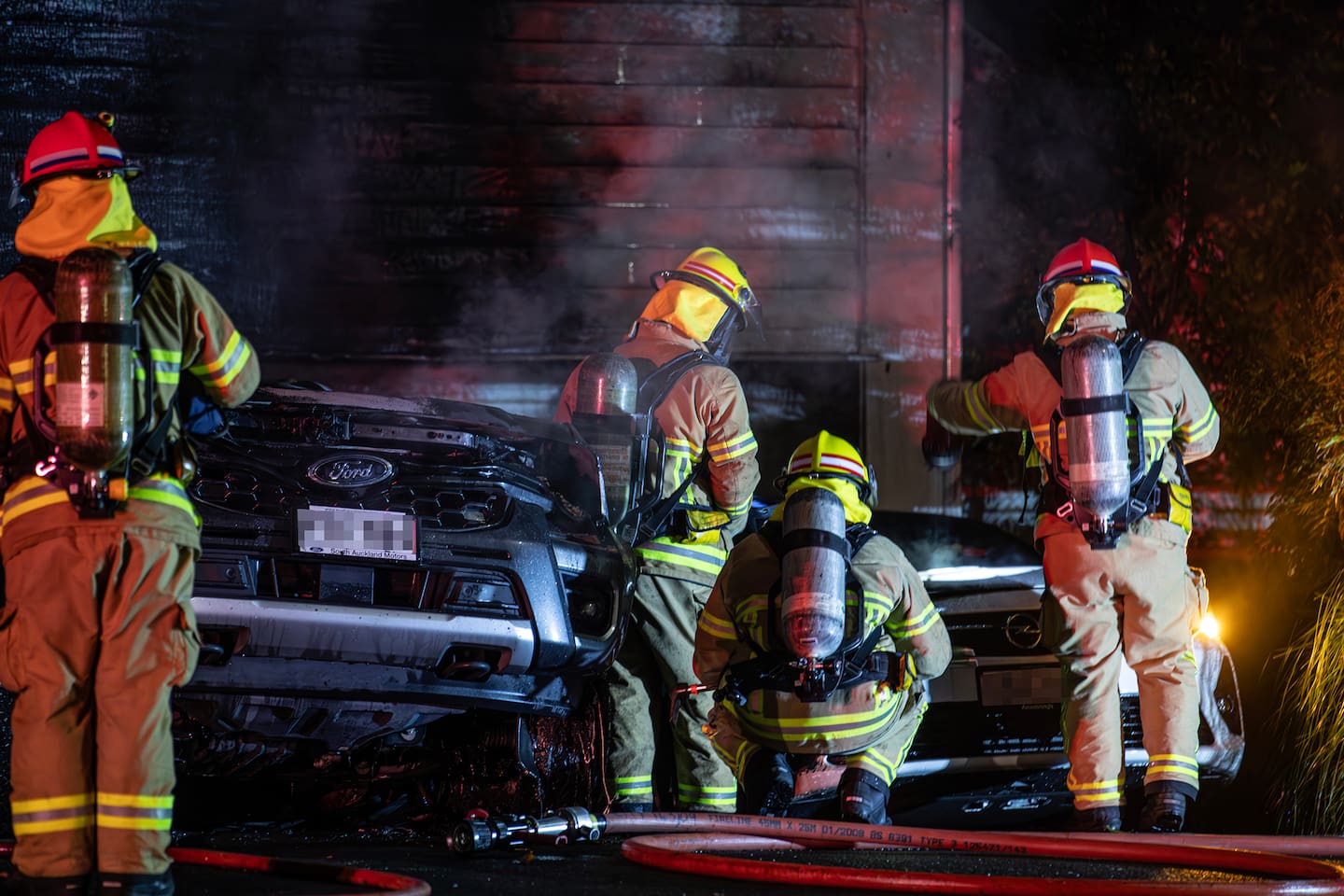 Fire crews from across central Auckland have contained a blaze involving an electric vehicle on Sunny Brae Crescent, Westmere. Photo / Hayden Woodward