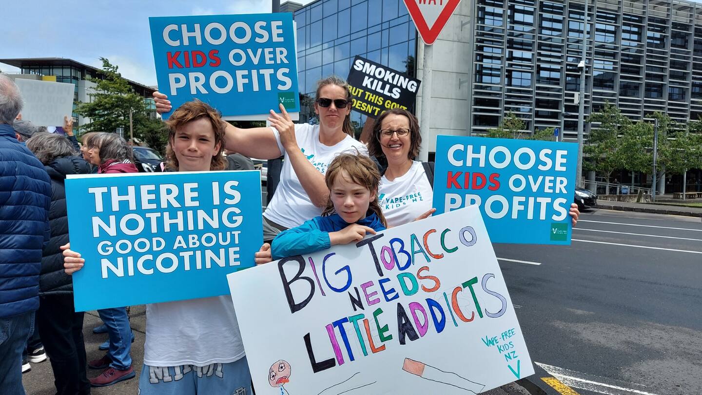 Vape-Free Kids NZ chairperson Marnie Wilton (right) and her two sons, Charyl Robinson (left) at the Vape-Free Kids Smokefree rally at Parliament last week.