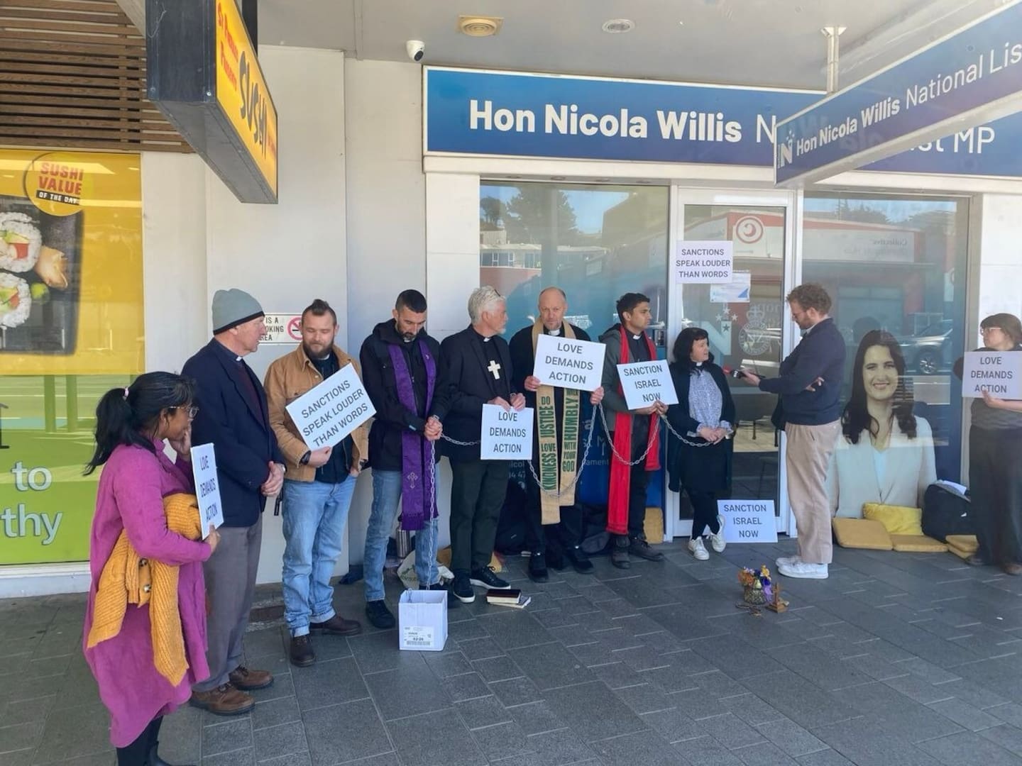 The members of the clergy have chained themselves to Willis' office.