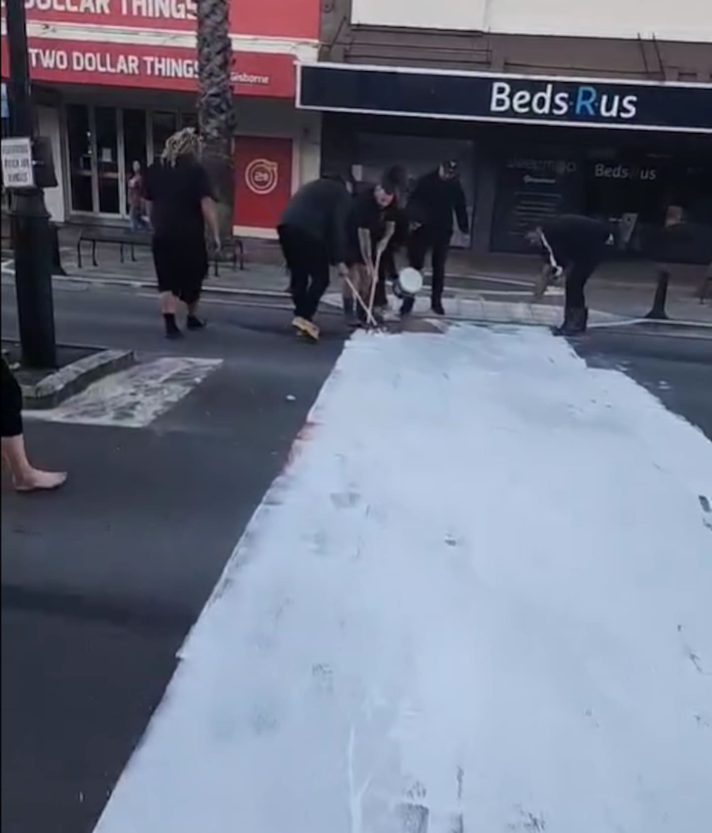 The group used white paint to cover the rainbow crossing on Gisborne's main street.