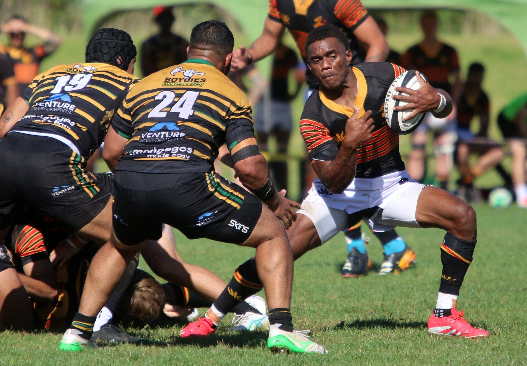 Kolinio Gonebale looks to break free of a would-be tackler. Photo / Stuart Whitaker