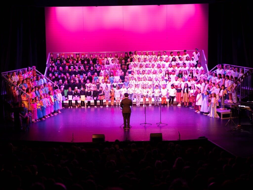  Jeremy Hantler conducting a previous Tauranga Primary Schools Music Festival at Baycourt. Photo / Supplied