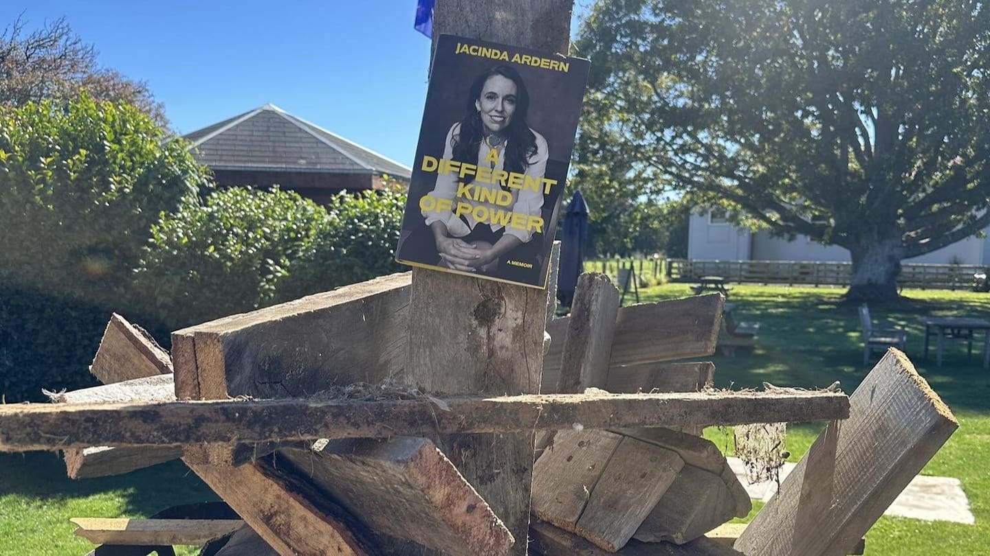 Jacinda Ardern's autobiography A Different Kind of Power on the burn pile at Black Dog Tavern in Mākōtuku.