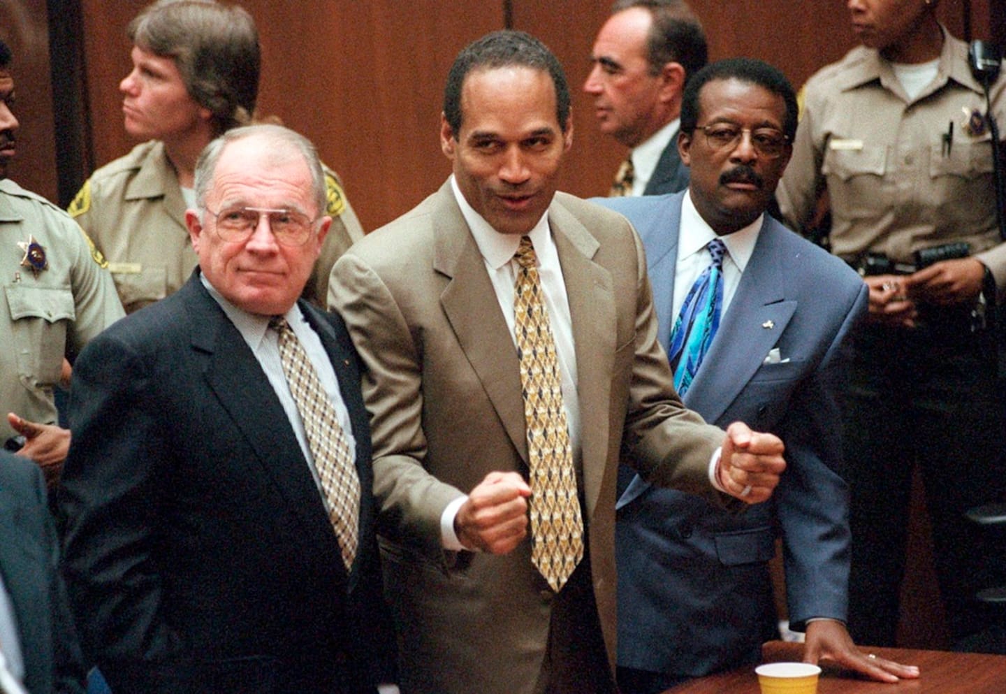 In this October 3, 1995, file photo, OJ Simpson reacts as he is found not guilty. Defence attorneys F. Lee Bailey (left), and Johnnie L. Cochran Jr. stand with him. Photo / via AP