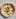 The potato pizza at Esplanade was served with fresh basil and sliced parmesan.
