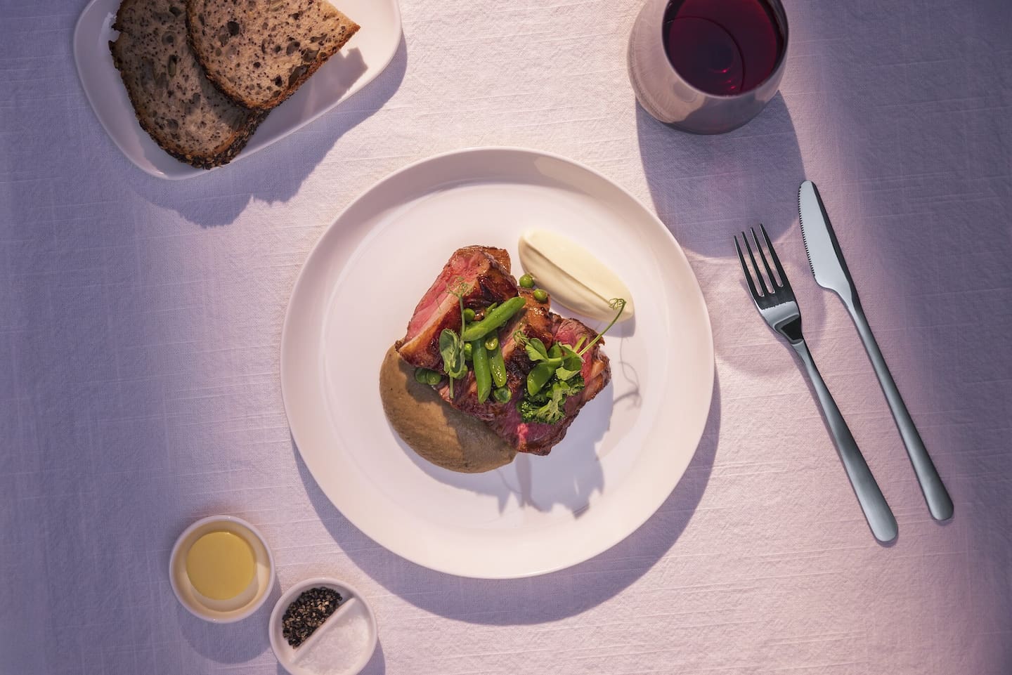 Among his personal favourites are lamb rump with smoked aubergine, spring peas, harissa, labneh and rosemary. Photo / Air New Zealand