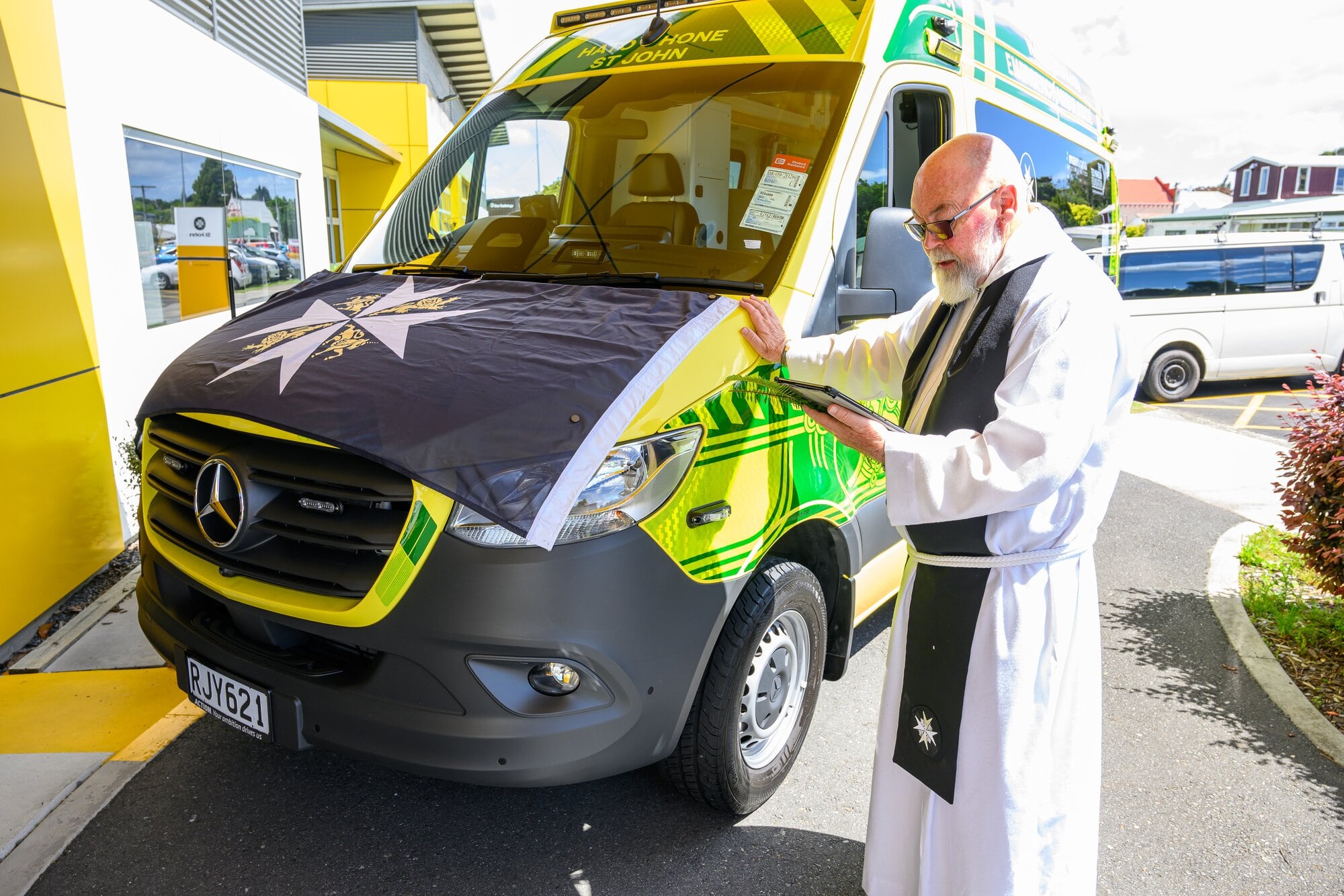 One of the new ambulances being blessed by chaplain Rev John Hebenton.
Photo / David Hall