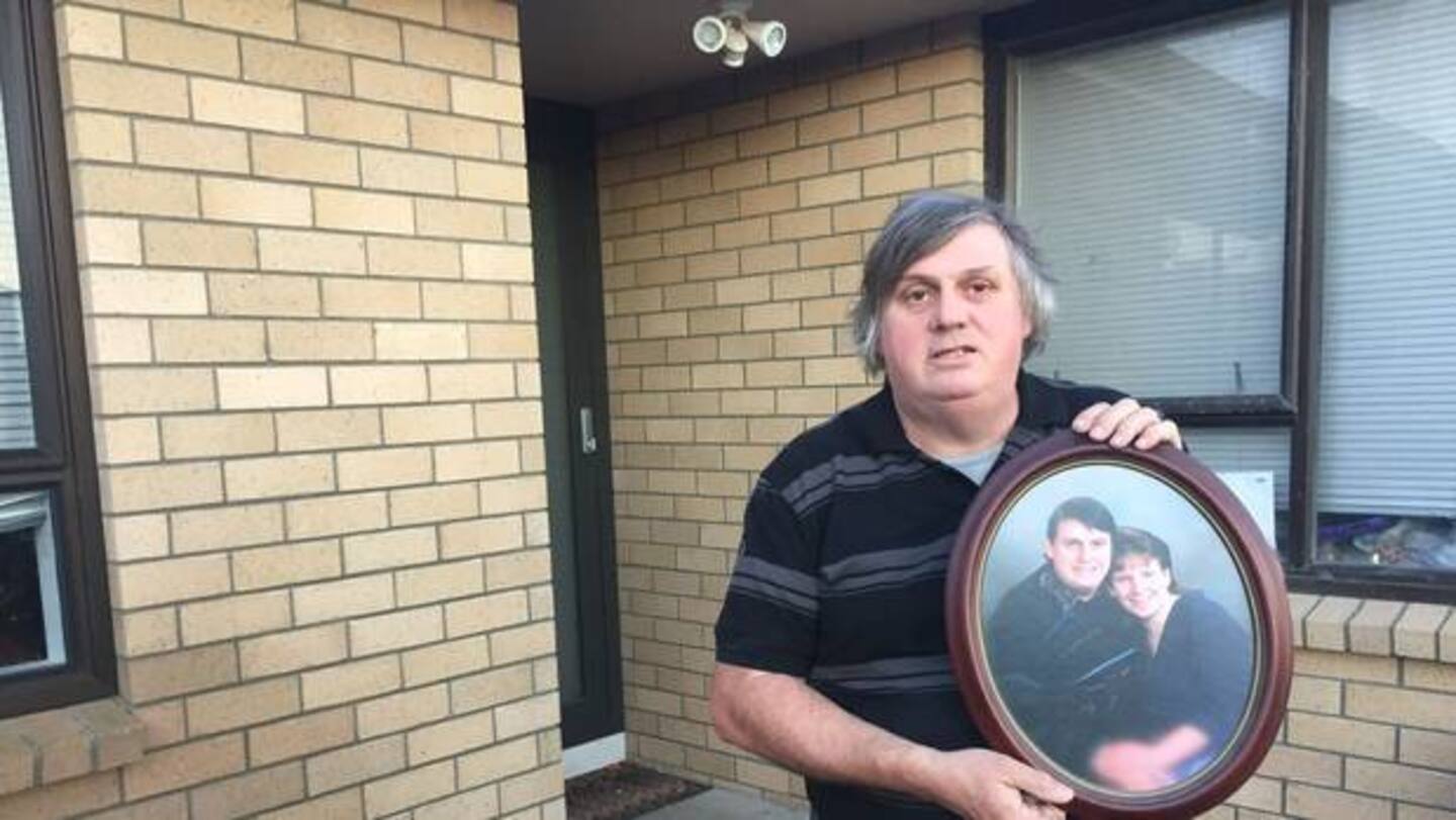 Laurie Anderson holds a photo of him with partner Angela Blackmoore who was murdered in 1995 just a week after the photo was taken. Photo / Kurt Bayer