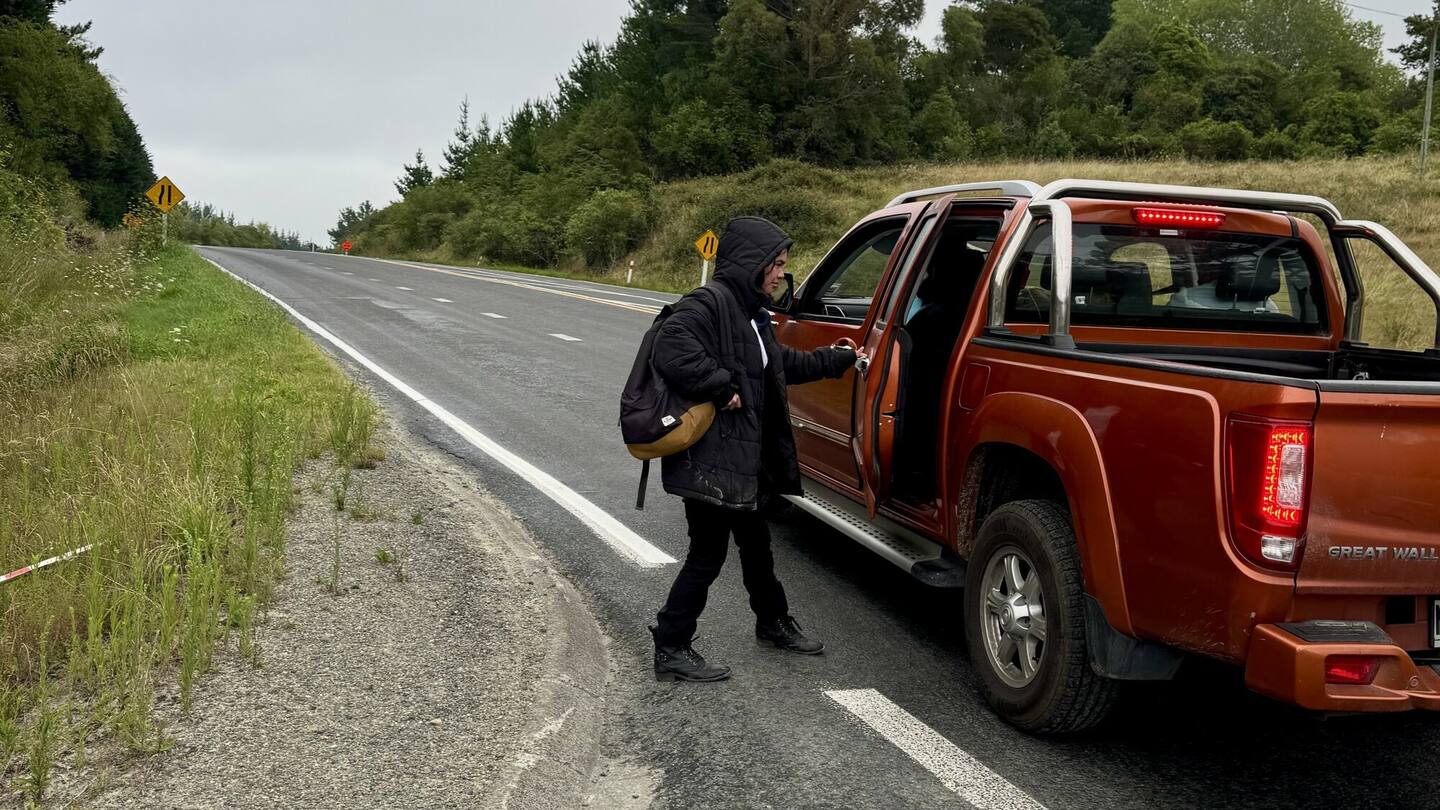 Laa Brown, 16, hops into a ute that she flagged down while hitchhiking to school. Photo / Mike Brown