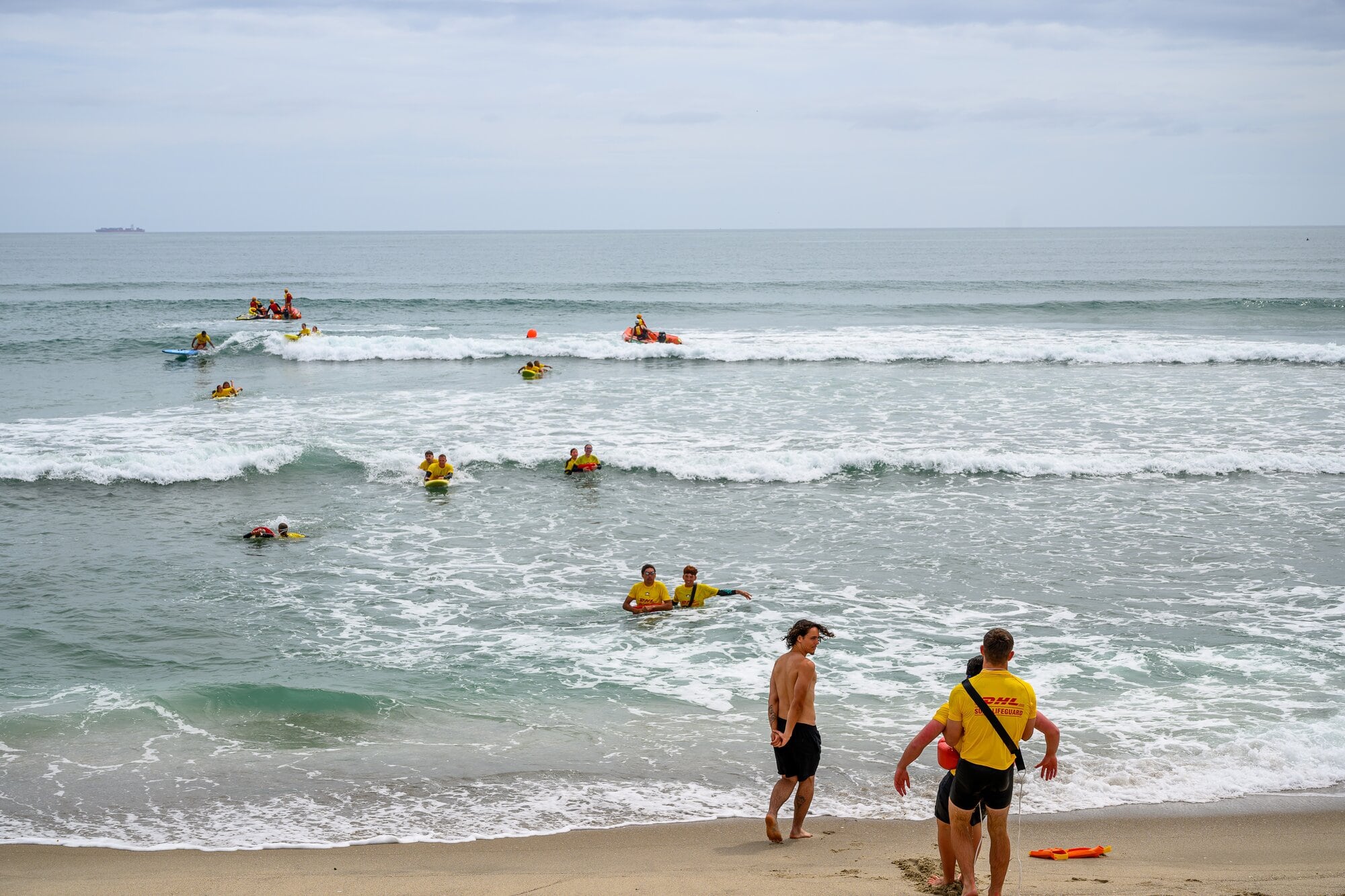 Surf lifeguards doing water rescue training at Mount Maunganui Main Beach this week. Photo / David Hall.