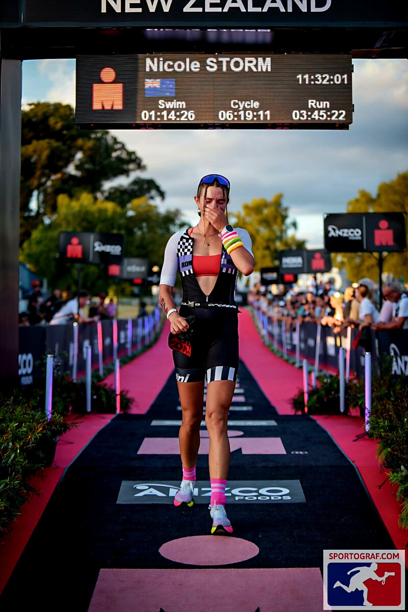  Pāpāmoa's Nicole Storm running across the finish line of the Taupō Ironman. Photo / supplied