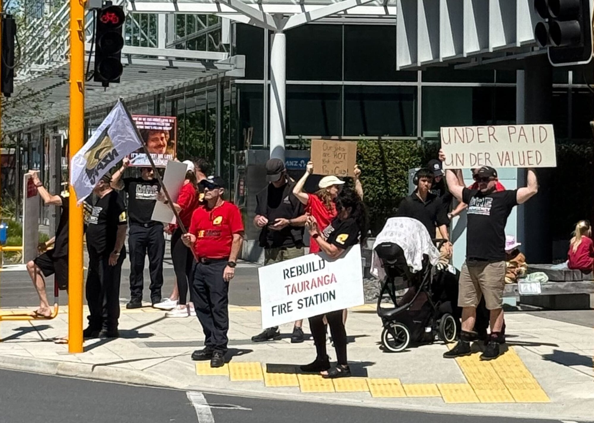 NZ Professional Firefighters Union members and their supporters at the Elizabeth St and Cameron Rd intersection. Photo / Bijou Johnson
