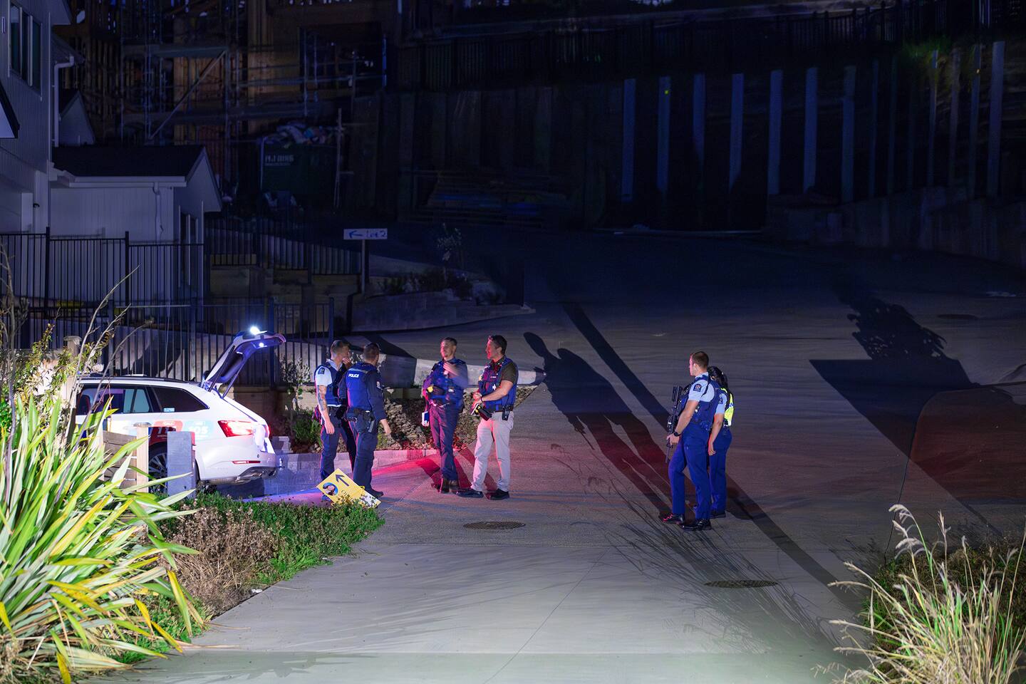 Police staff at an address on Mackay Dr Greenhithe after a woman was found nearby with serious injuries. Photo / Hayden Woodward