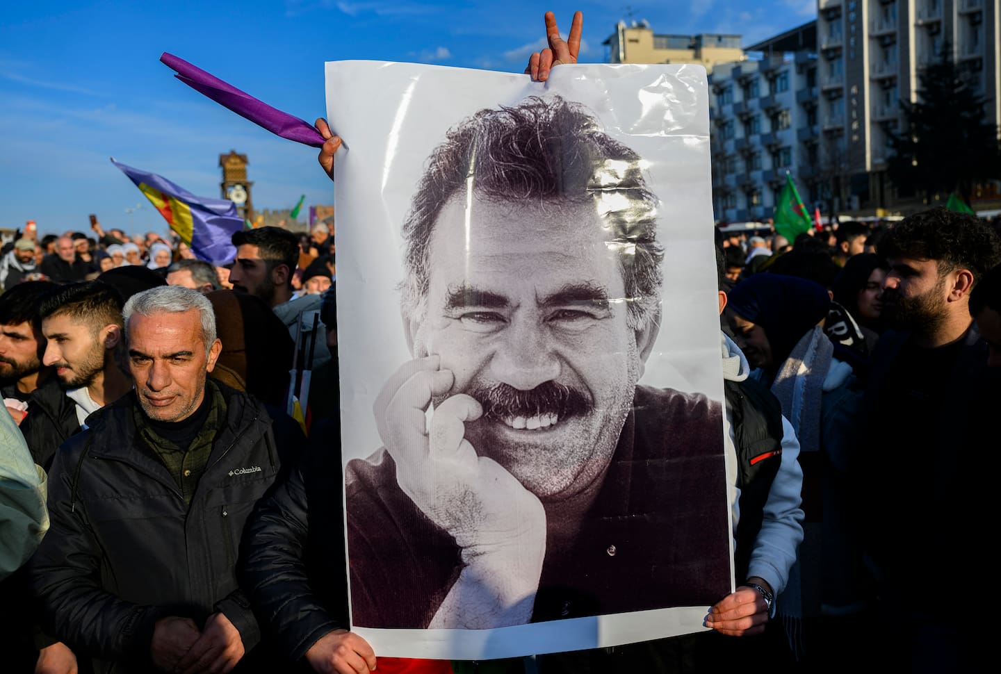 Supporters display a poster depicting the jailed leader of the Kurdistan Workers' Party (PKK) Abdullah Ocalan, 75, after he called on the Kurdistan Workers' Party (PKK) to disarm and dissolve itself. Photo / AFP